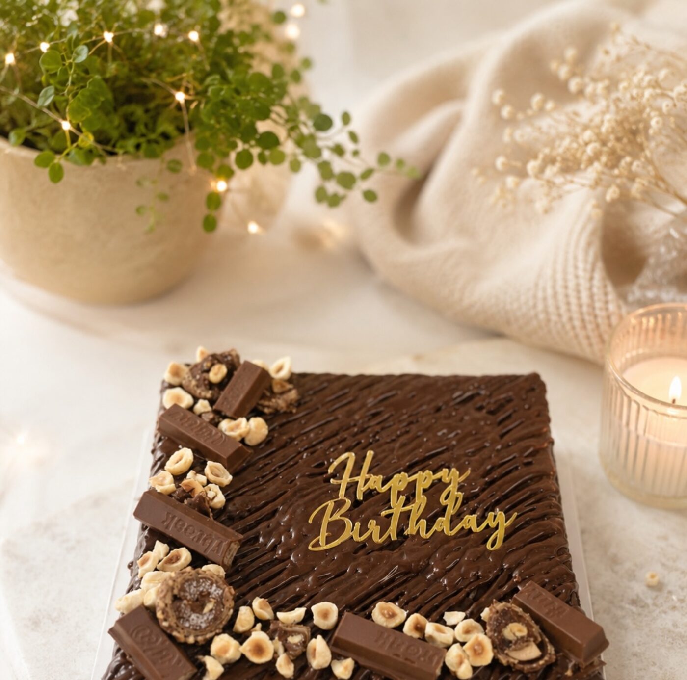 Chocolate brownie slab with a gold birthday message